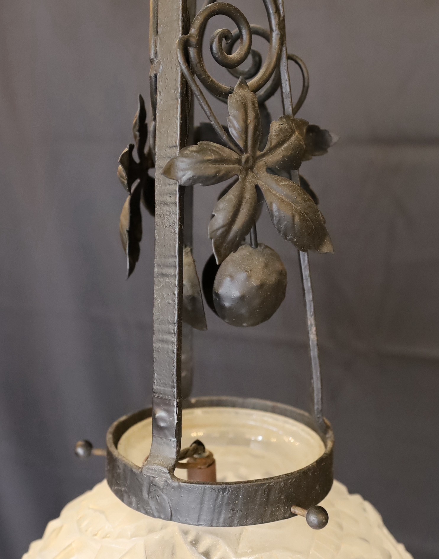 A 1920s French wrought iron and frosted glass pendant light fitting, in the manner of Edgar Brandt with Sabino style shade, height 90cm